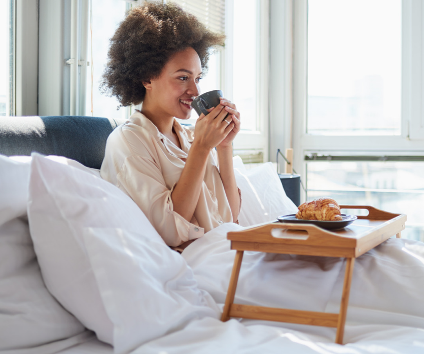 woman smiling on bed